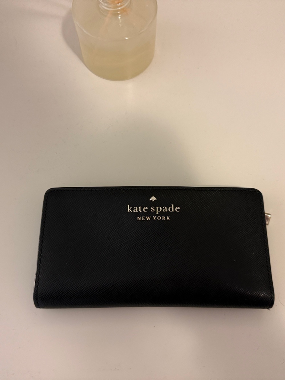 kate spade black zip-around continental wallet with gold logo